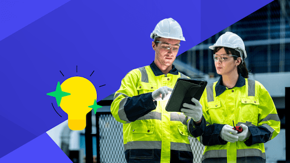 Manufacturing workers looking at tablet