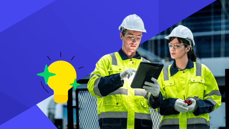 Manufacturing workers looking at tablet