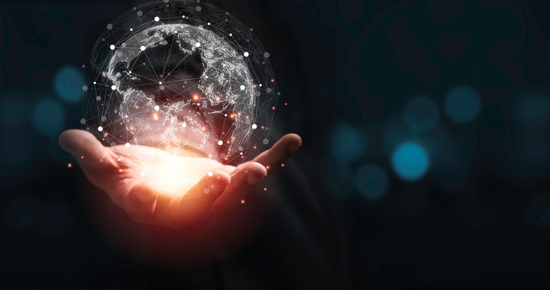 Person holding a connected world in their hands