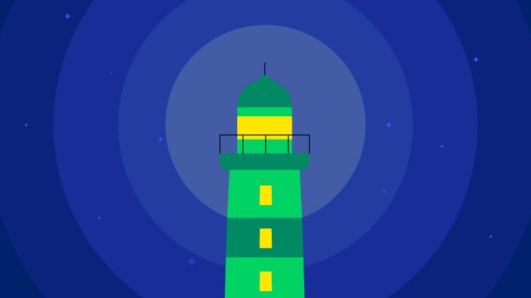 Green lighthouse against blue starry sky