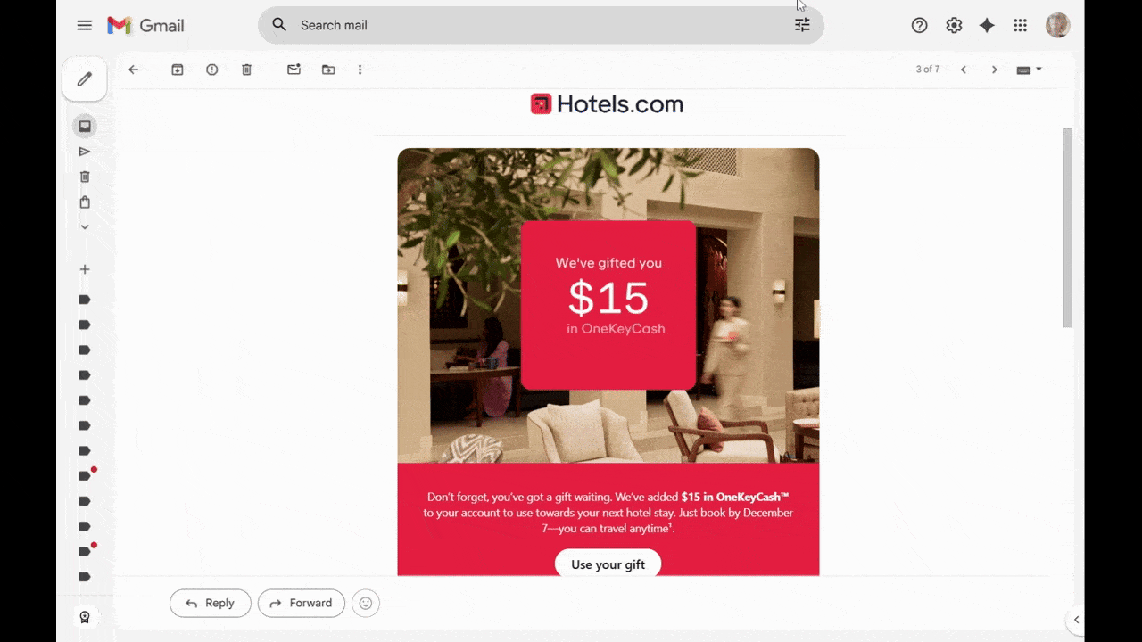 A video showing the animated message included in a Hotels.com email. Over a somewhat blurred image of someone walking through the lobby of a neutral-toned hotel lobby is a small red block. An animated message appears. It reads ‘We’ve gifted you $15 in OneKeyCash’.
