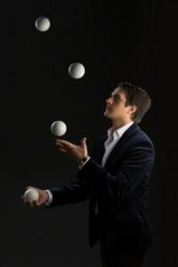 Young man juggling balls