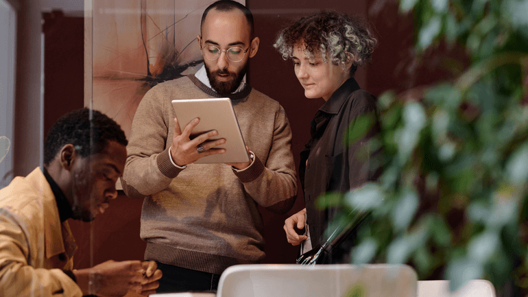 3 people collaborating in an office setting