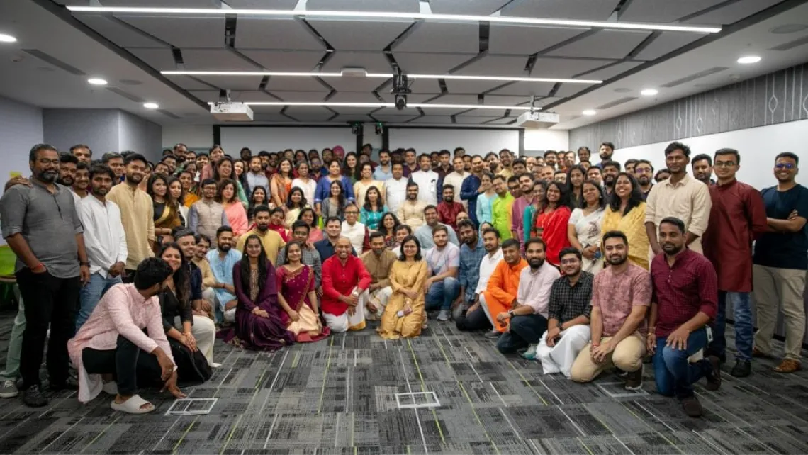 employees in a photo in the progress india office