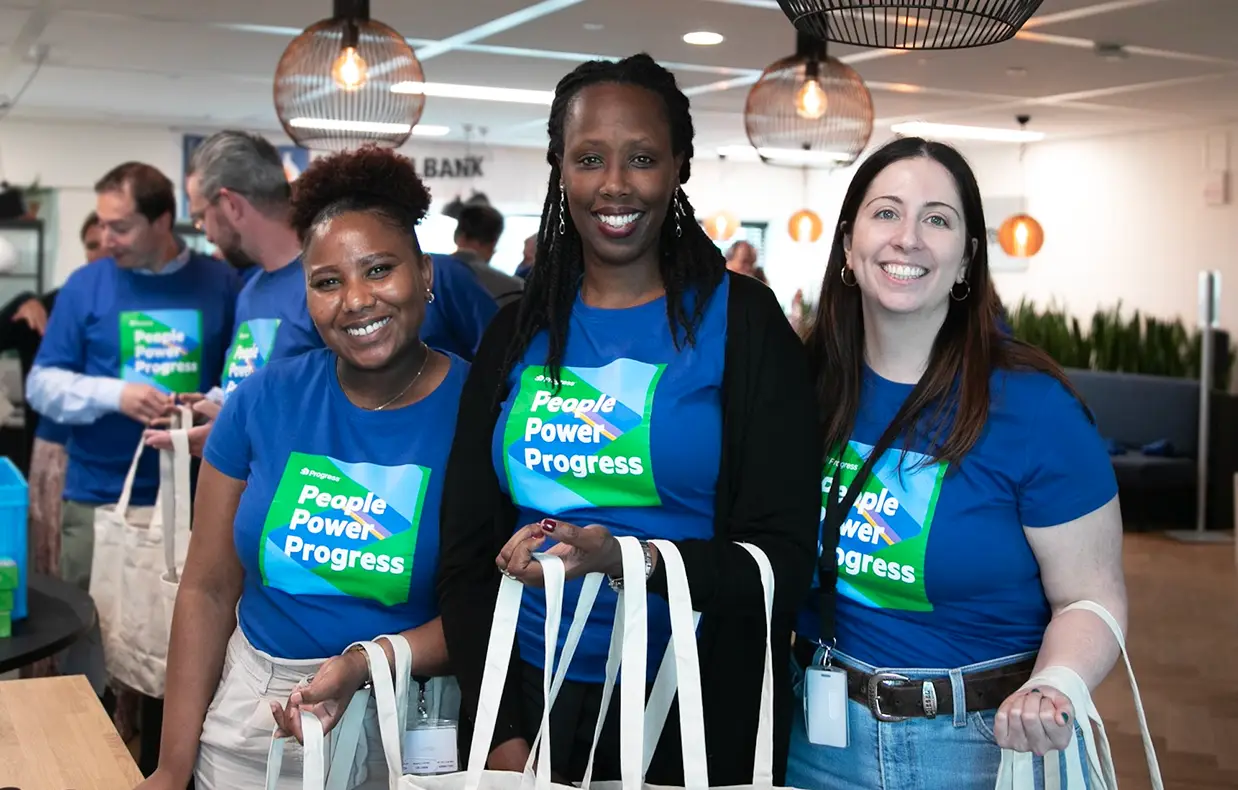 colleagues in the progress office with people power progress t-shirts